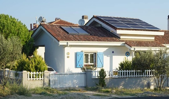 residential building with photovoltaic panels on the roof